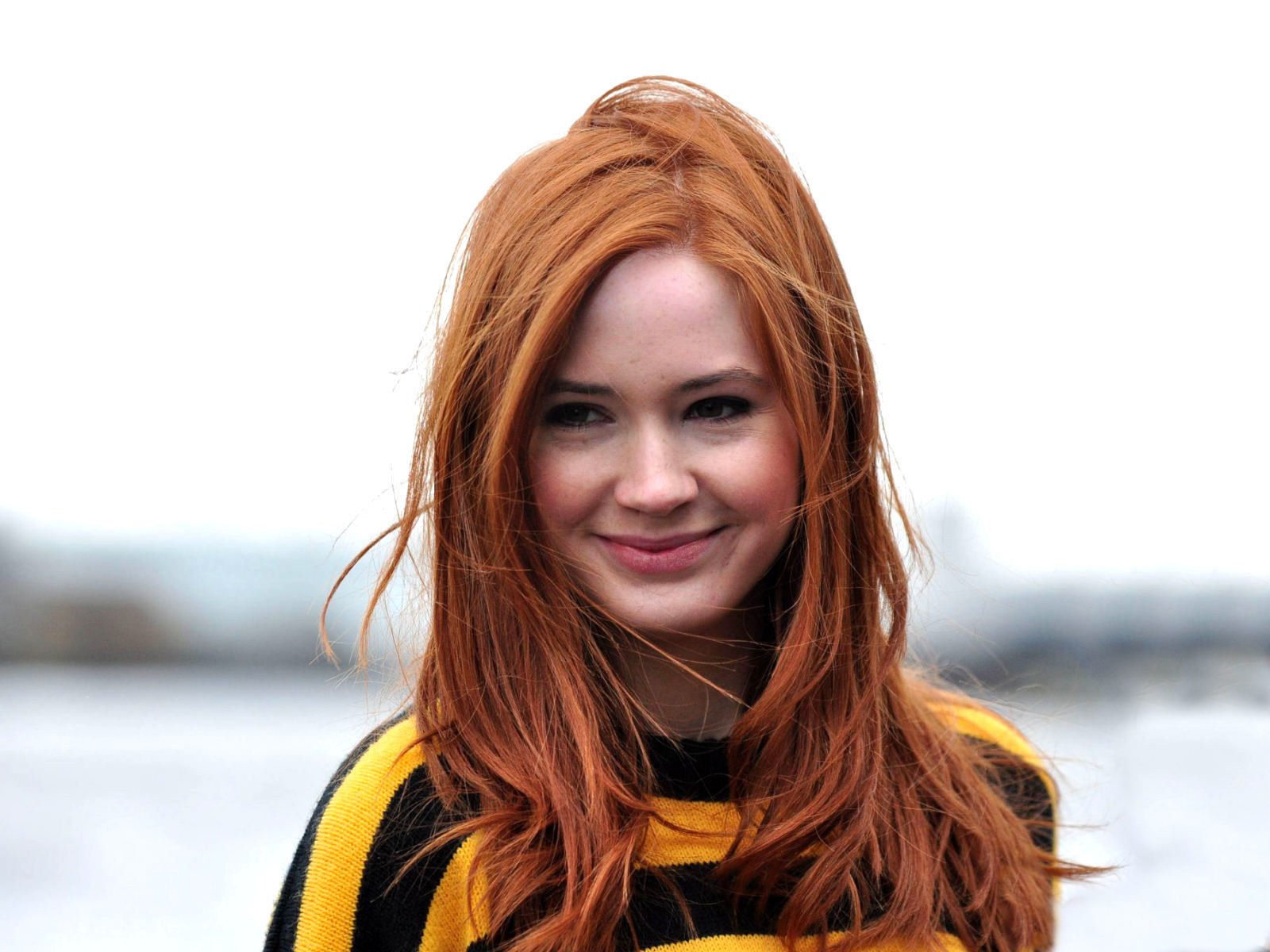 red-haired woman smiling