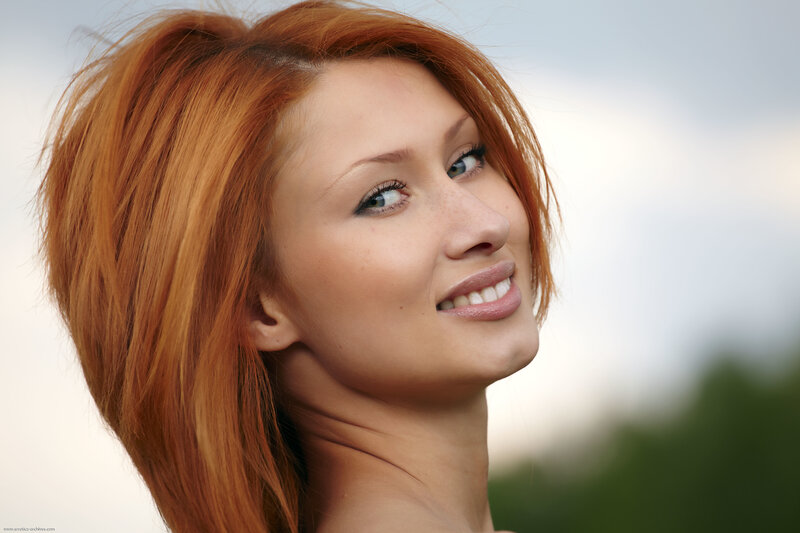 red-haired woman smiling