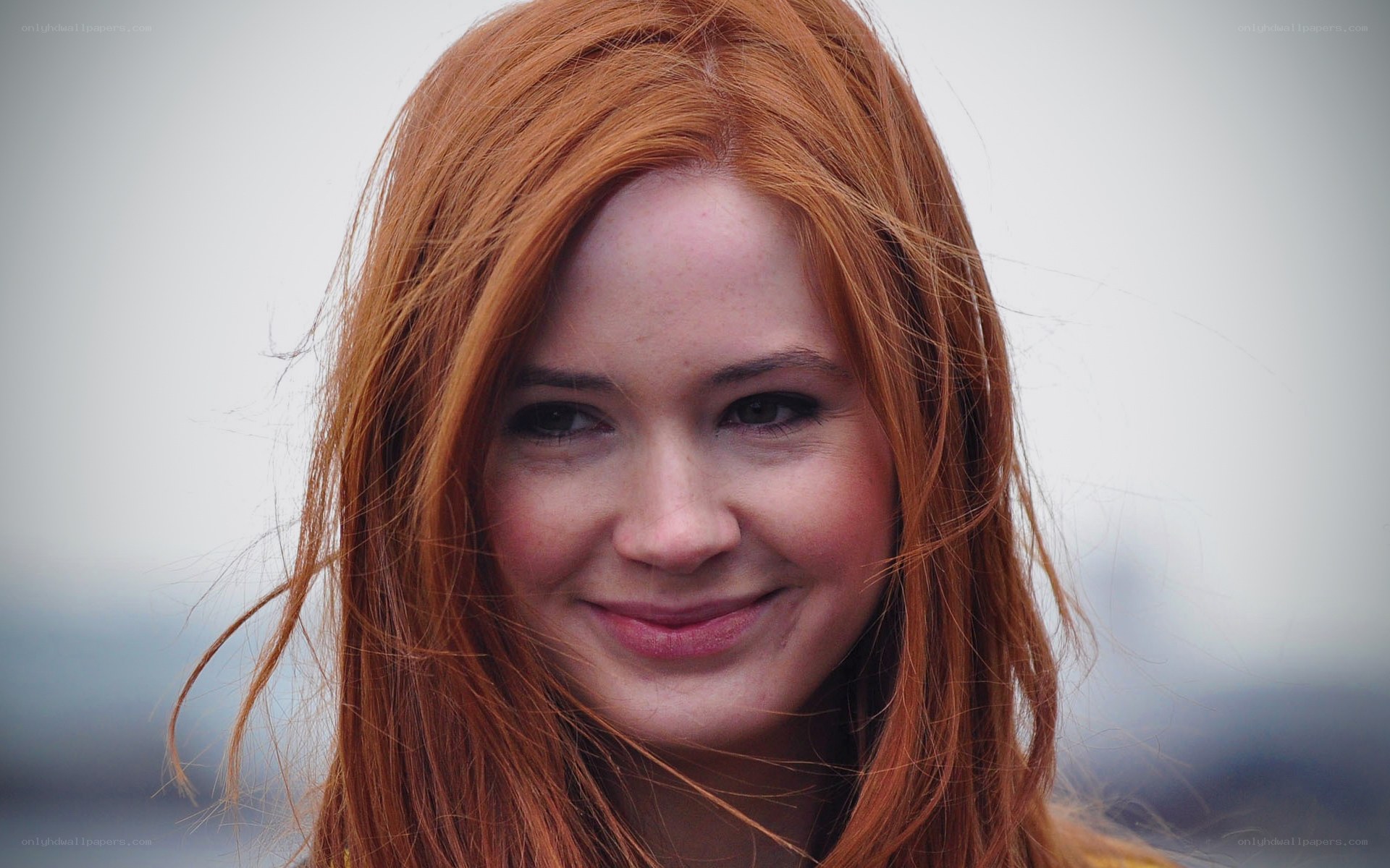 red-haired woman smiling