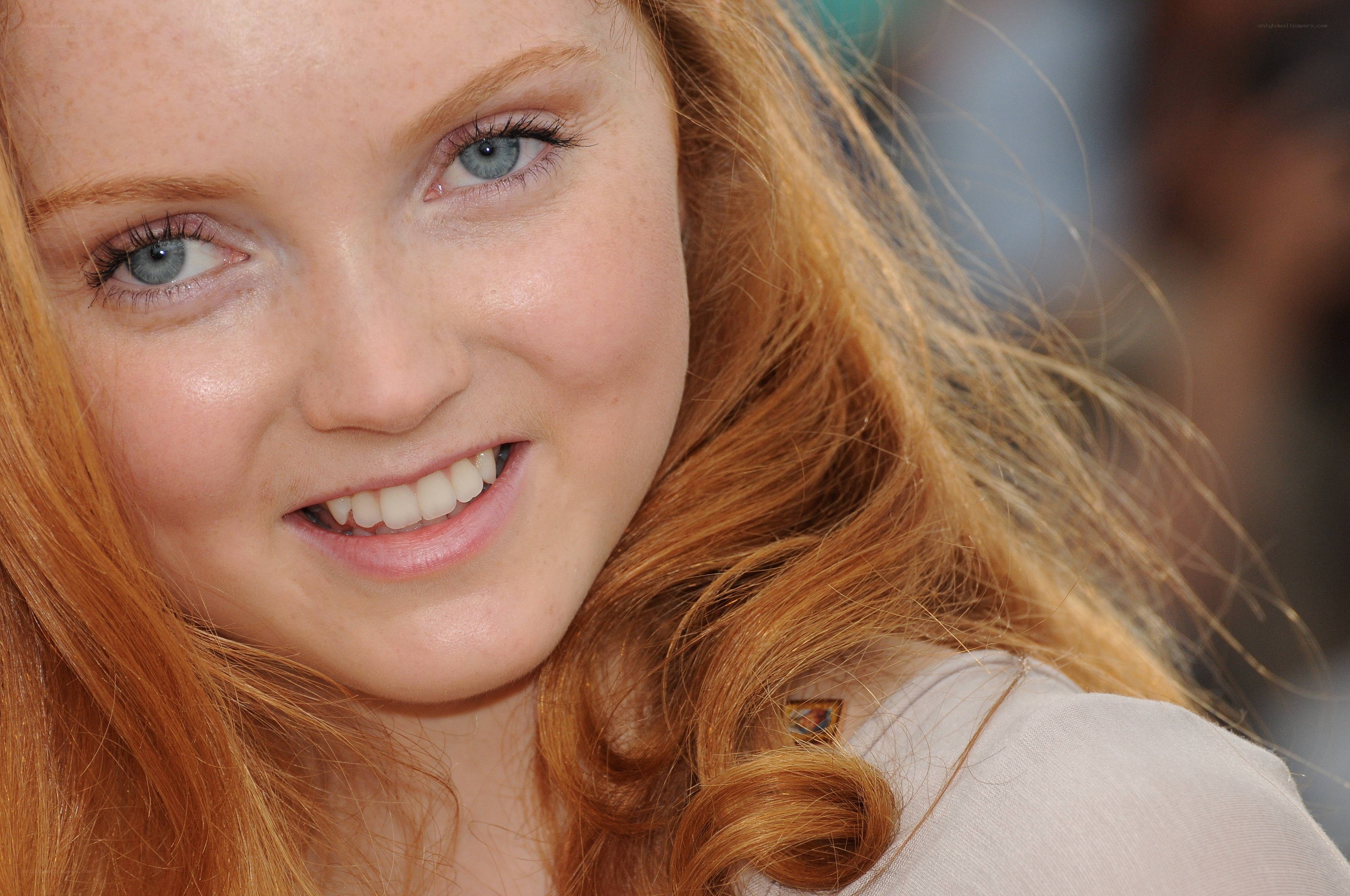 red-haired woman smiling