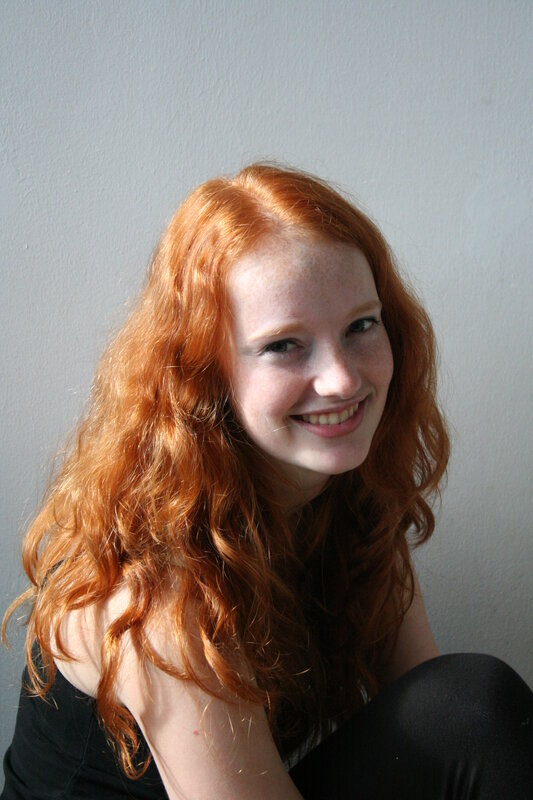 Red-haired woman smiling