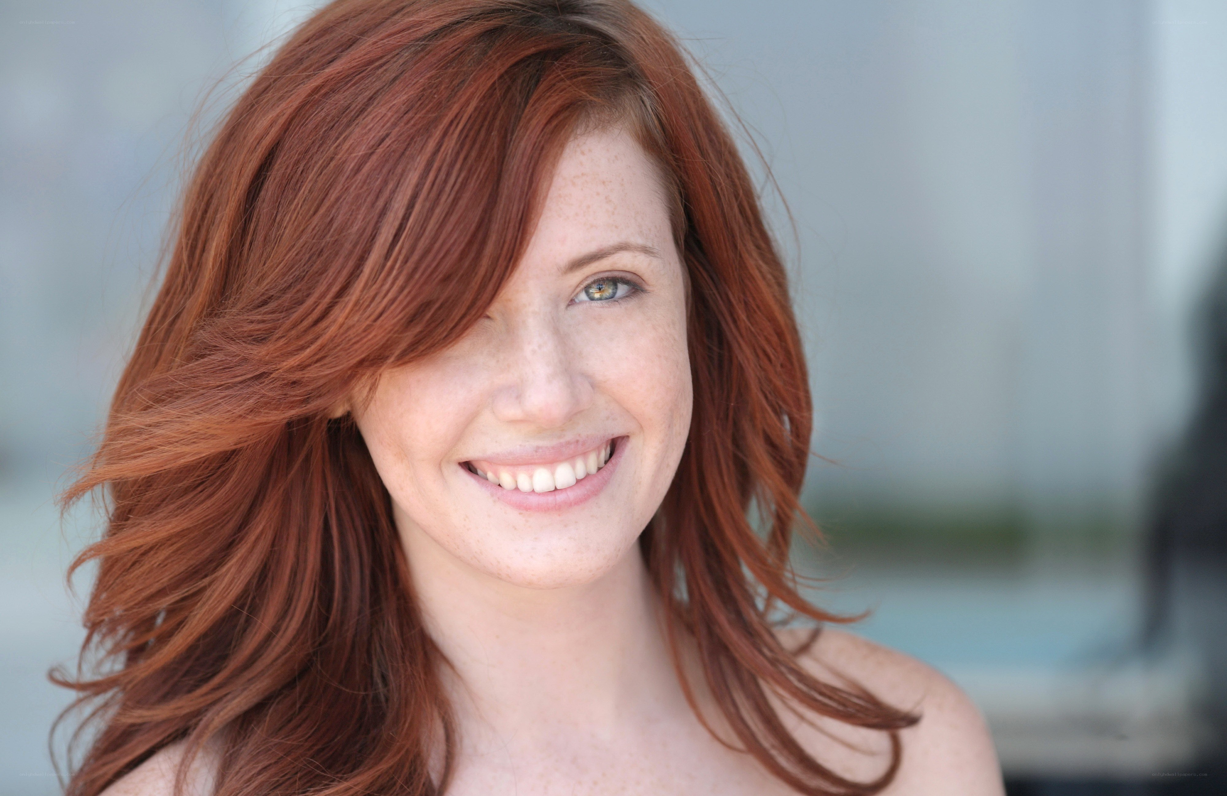 red-haired woman smiling