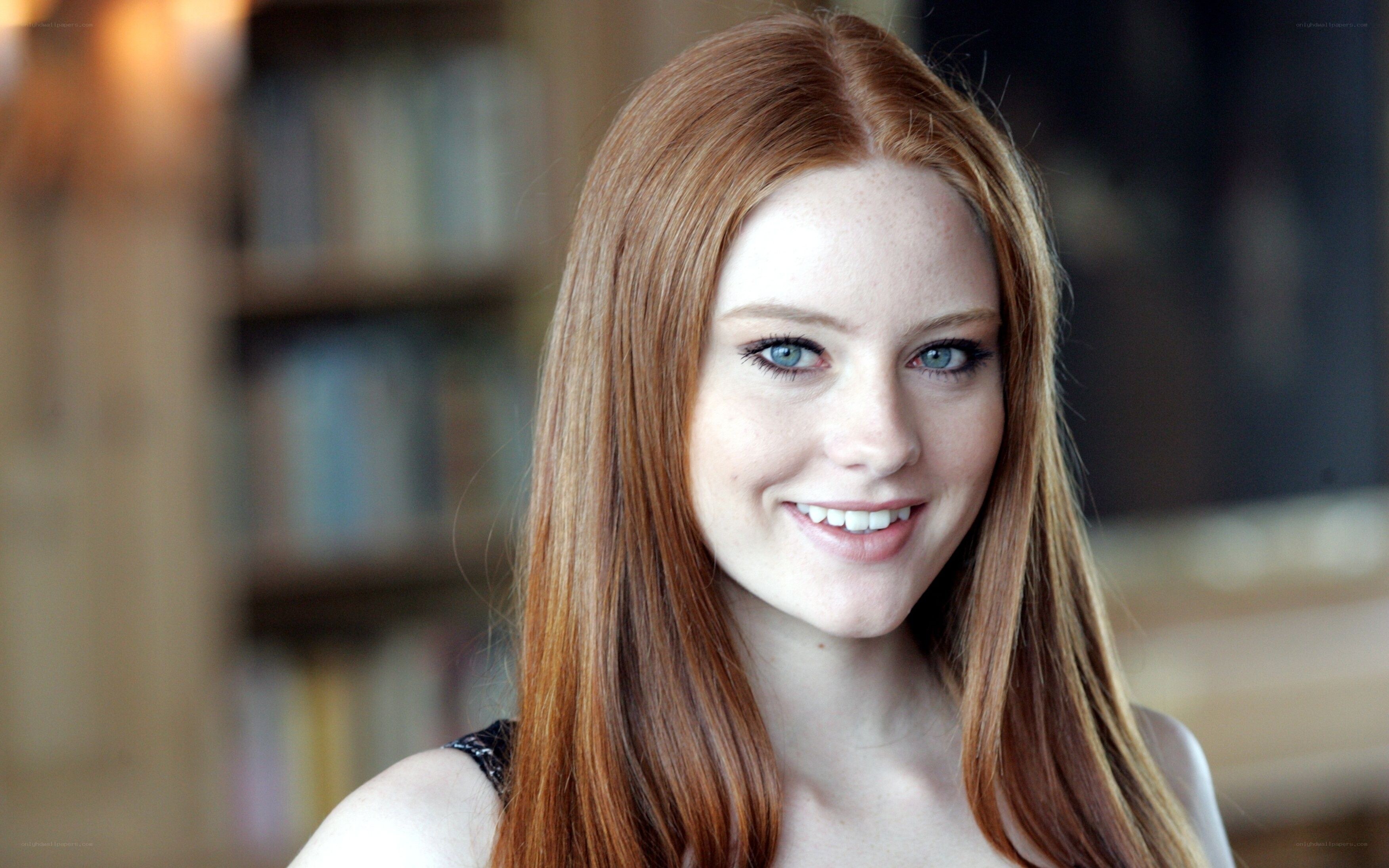 red-haired woman smiling