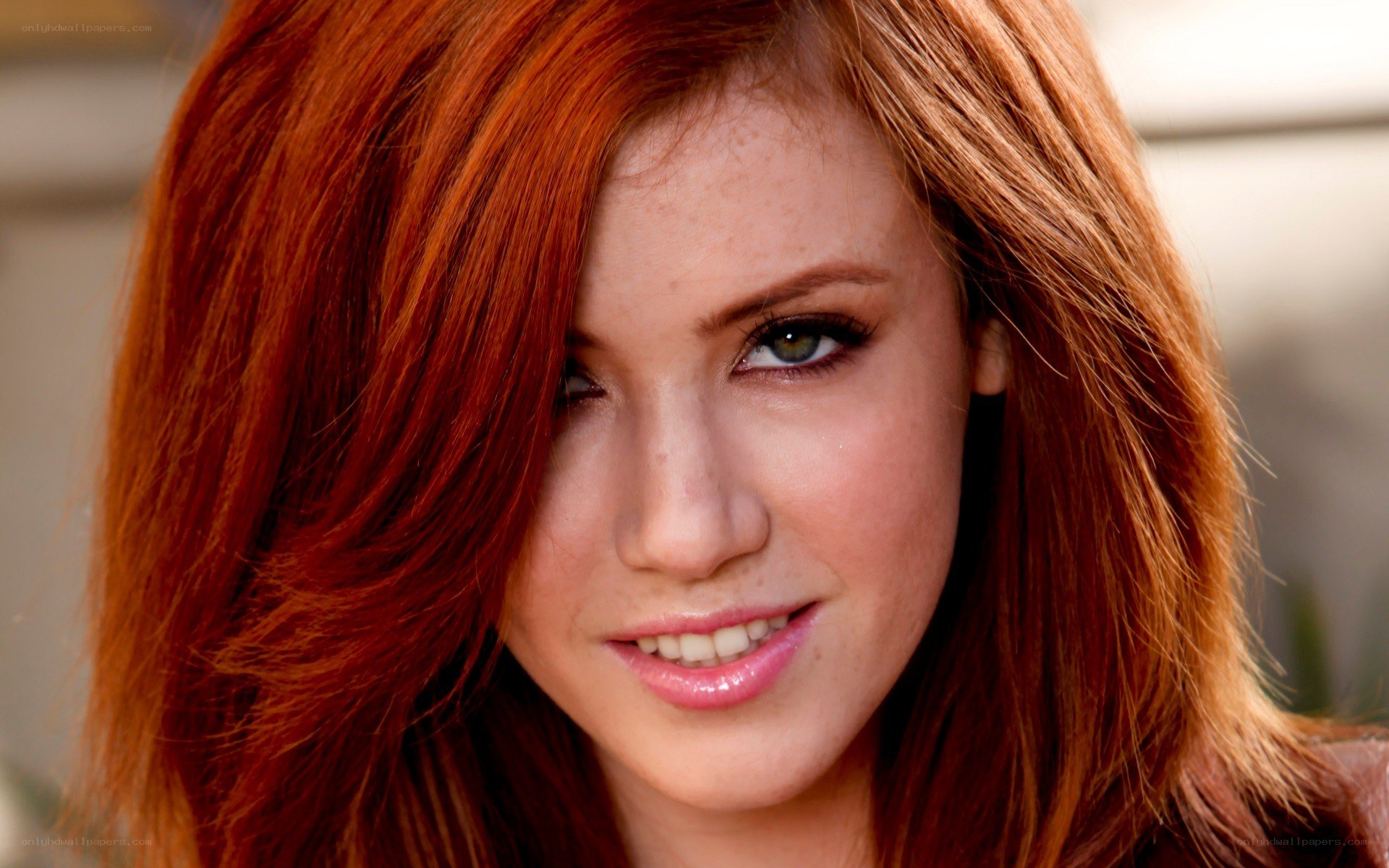 red-haired woman smiling