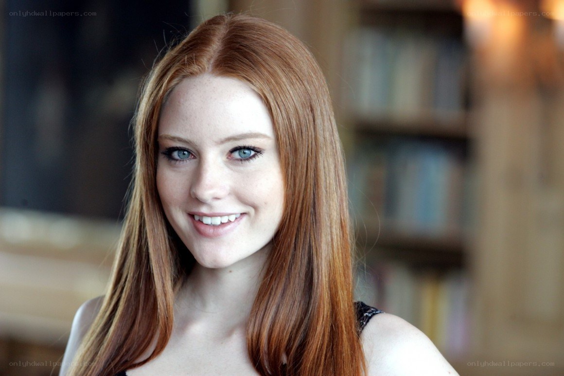 red-haired woman smiling