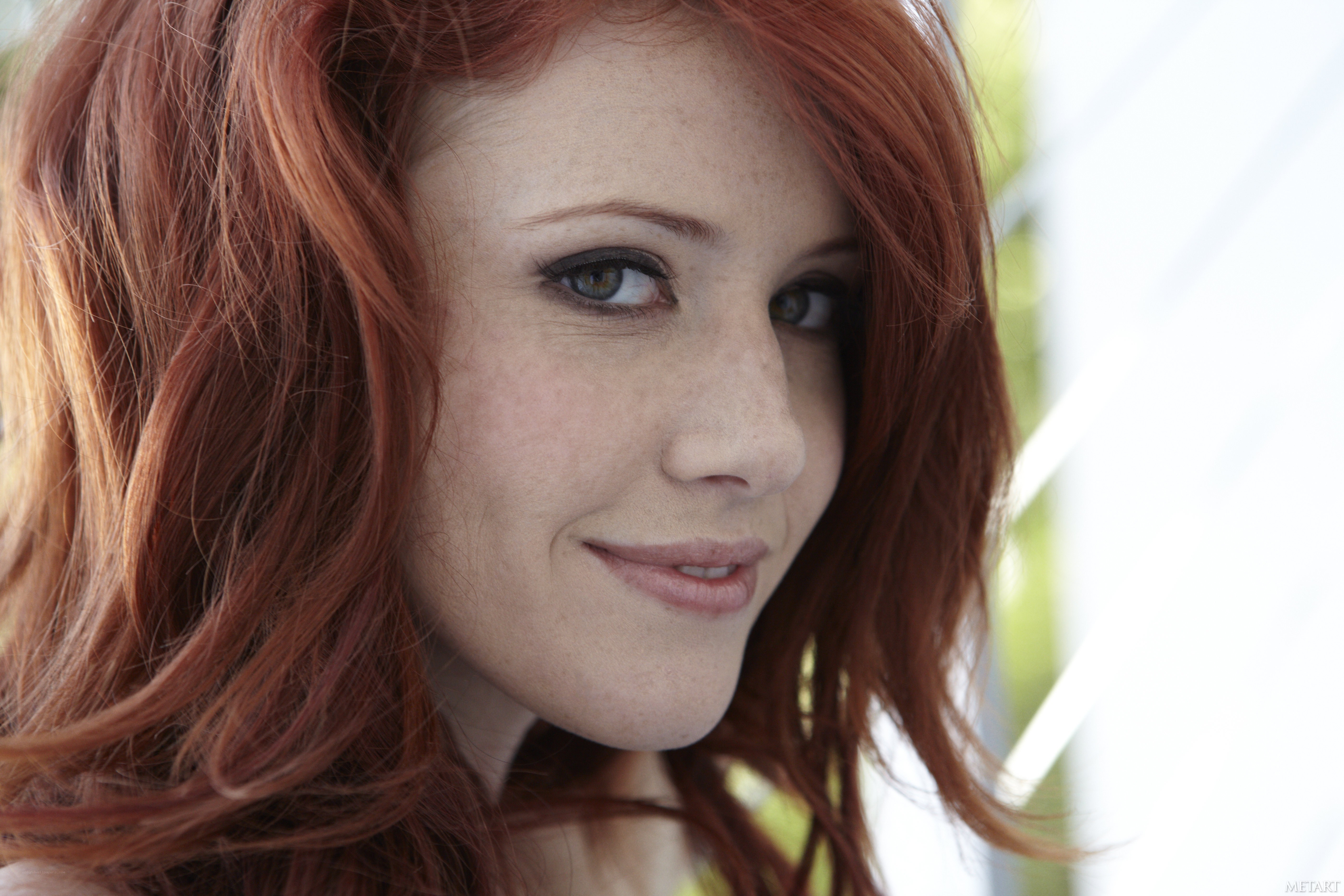 red-haired woman smiling
