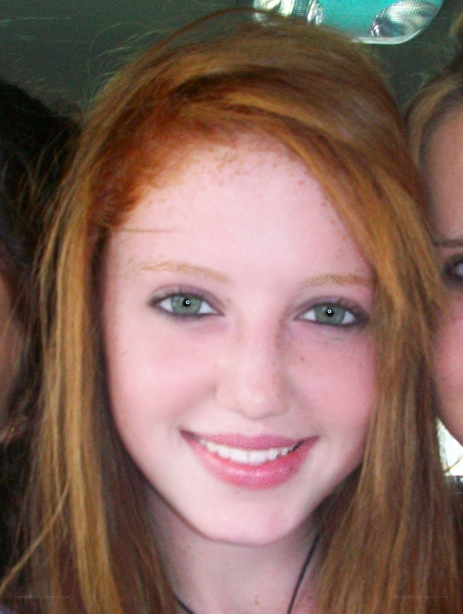 red-haired woman smiling