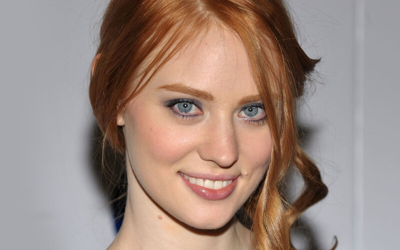red-haired woman smiling