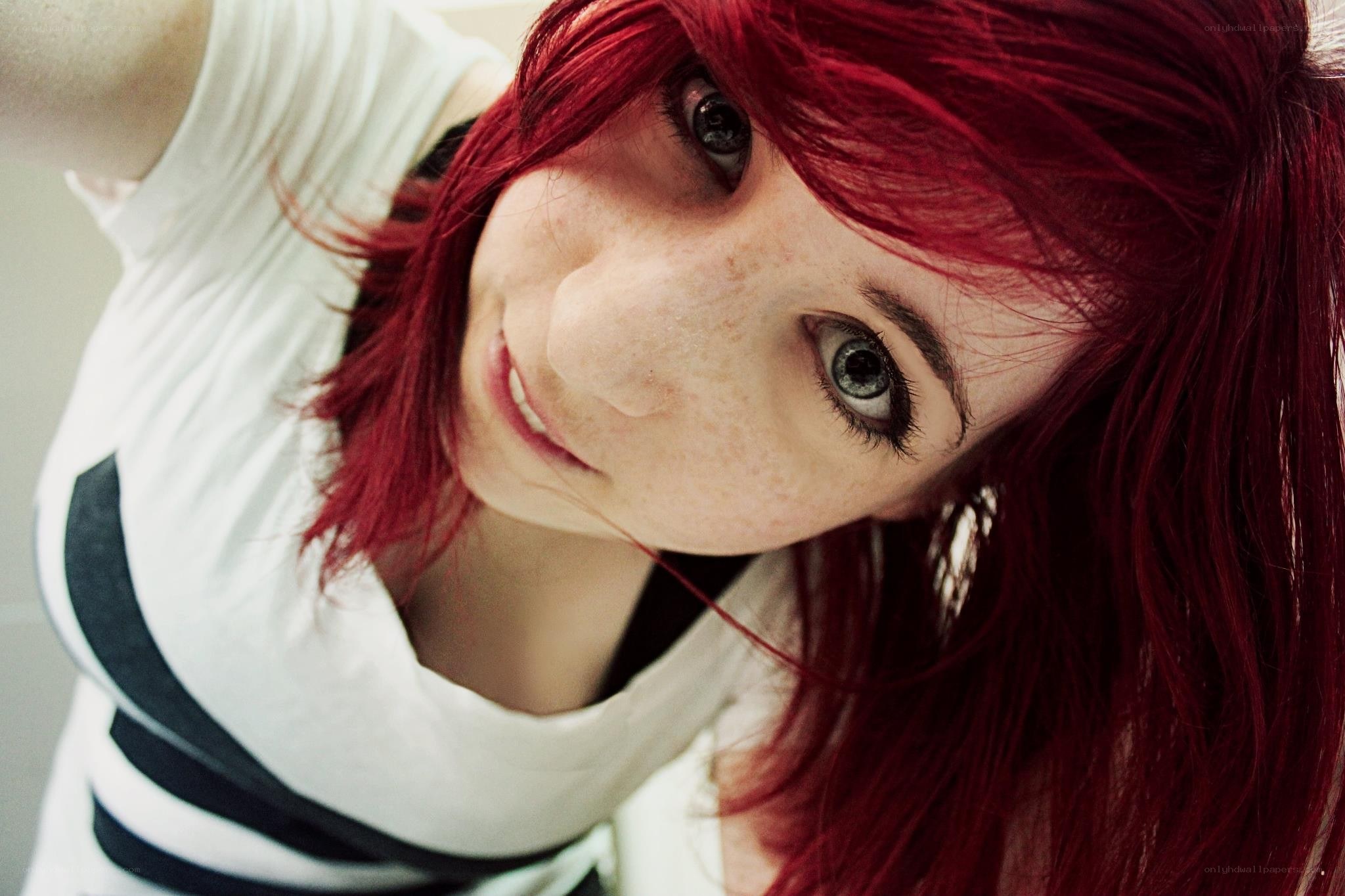 red-haired woman smiling