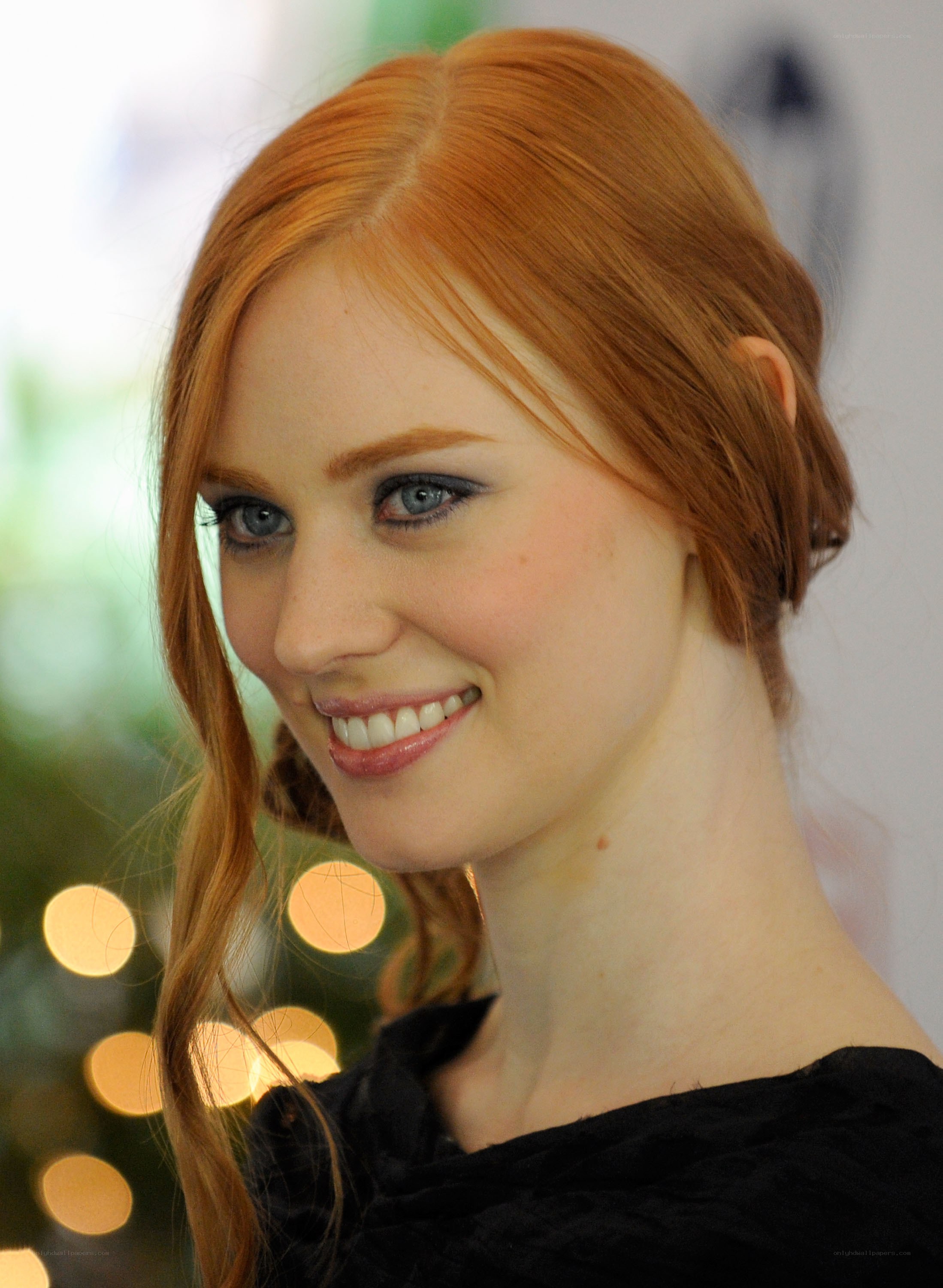 red-haired woman smiling