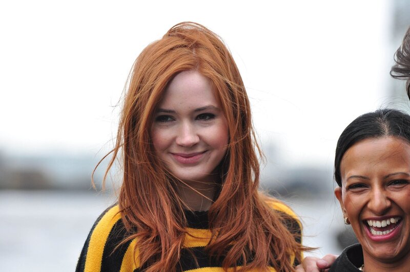 Red-haired woman smiling with friend