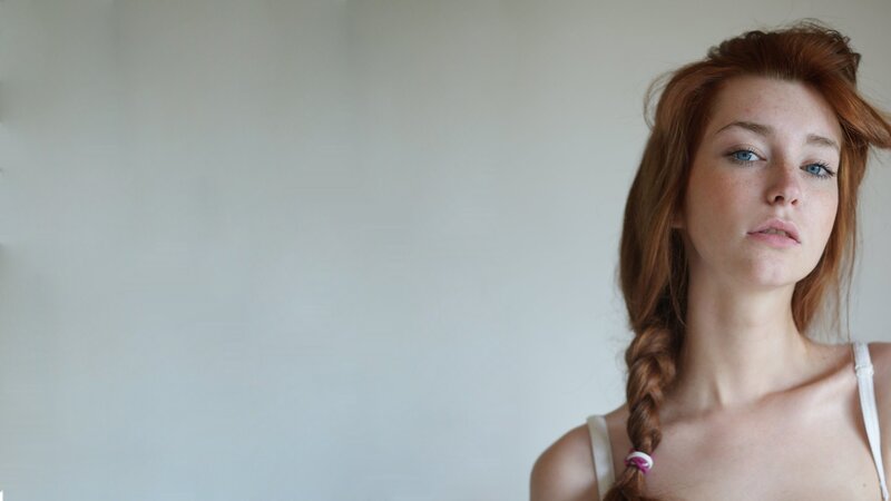 Red-haired woman with blue eyes