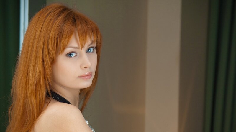 Red-haired woman with blue eyes
