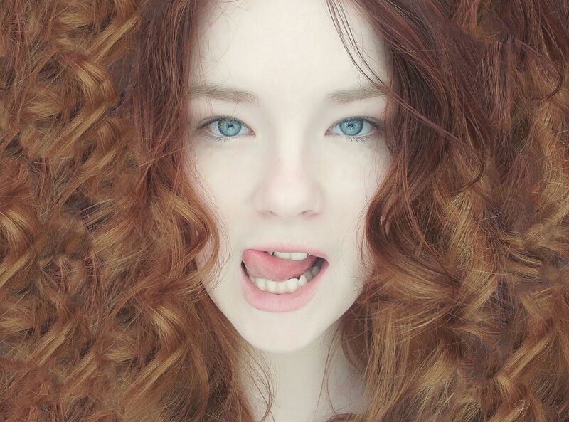 red-haired woman with blue eyes