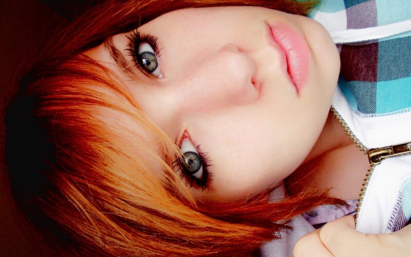 red-haired woman with blue eyes