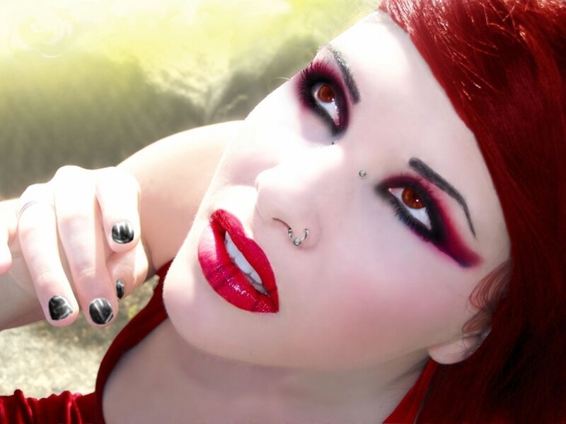 red-haired woman with bold makeup