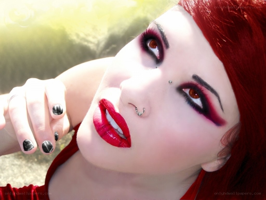 red-haired woman with bold makeup