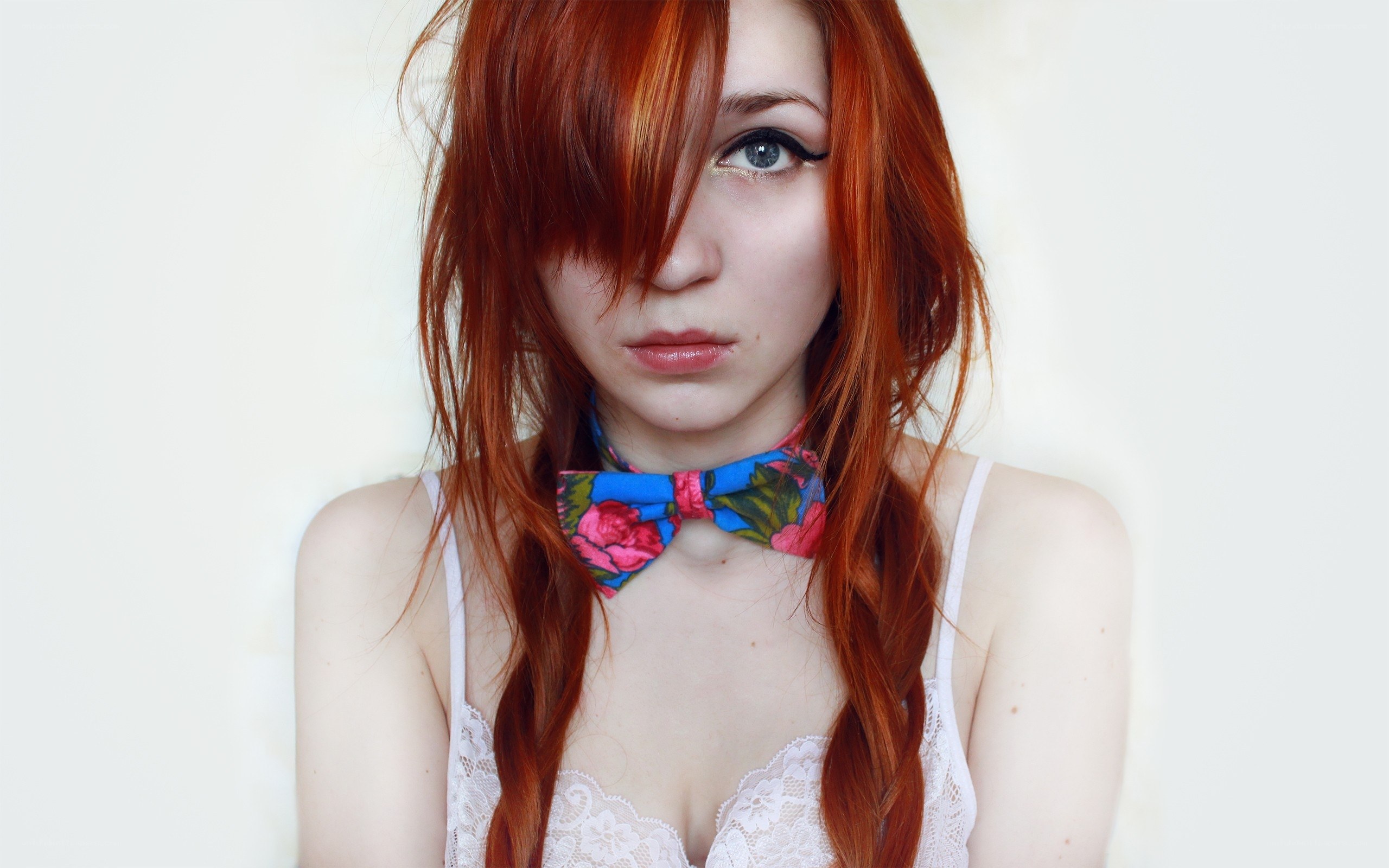 Red-haired woman with bow tie