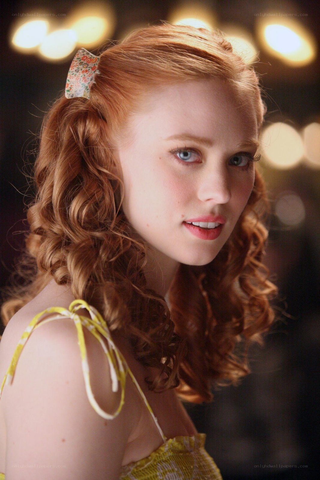 red-haired woman with bow