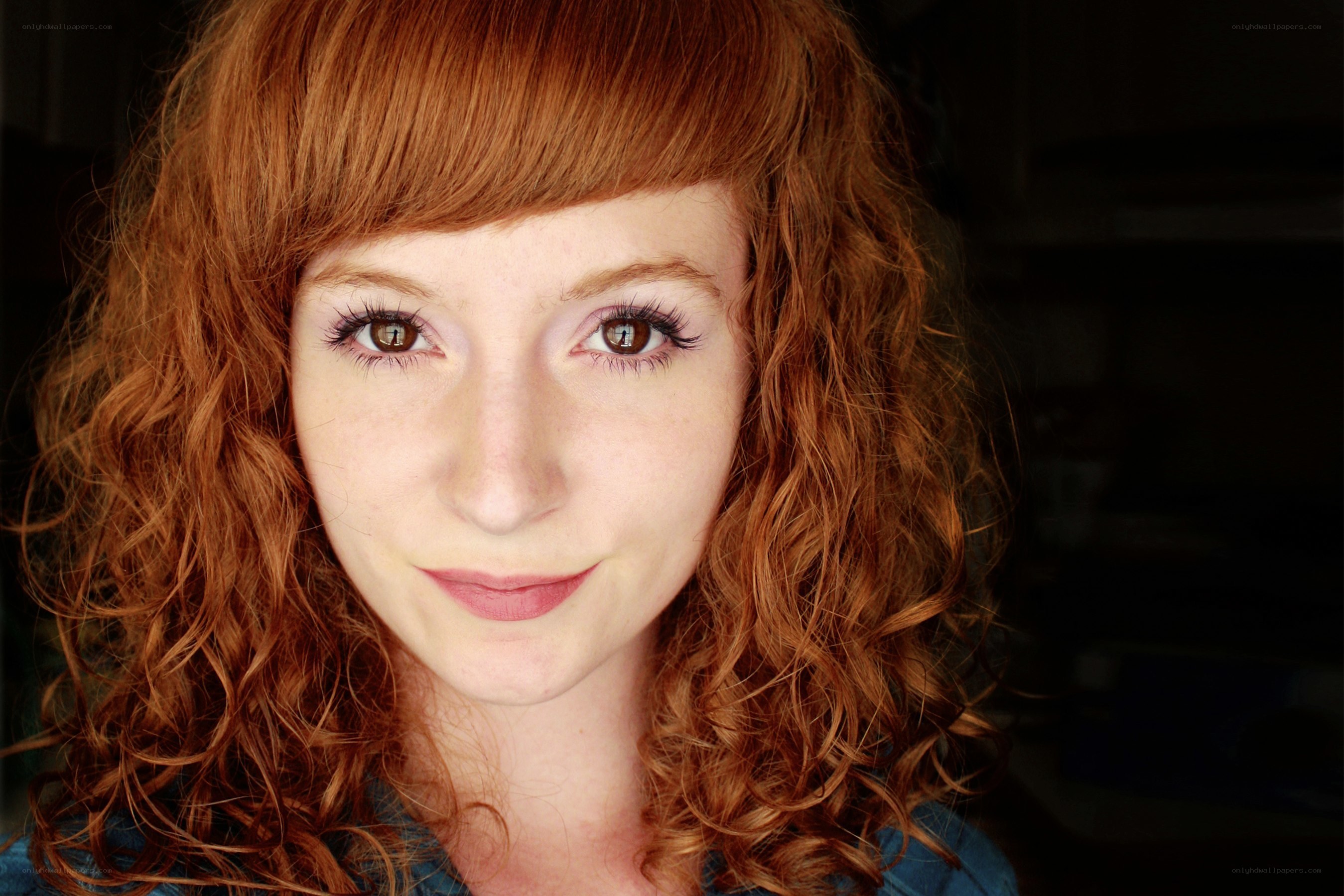 red-haired woman with curls