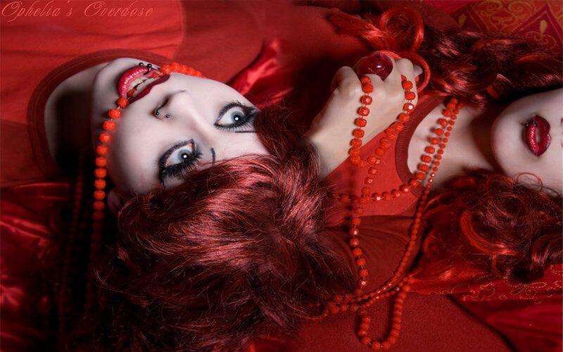 Red-haired woman with dramatic makeup