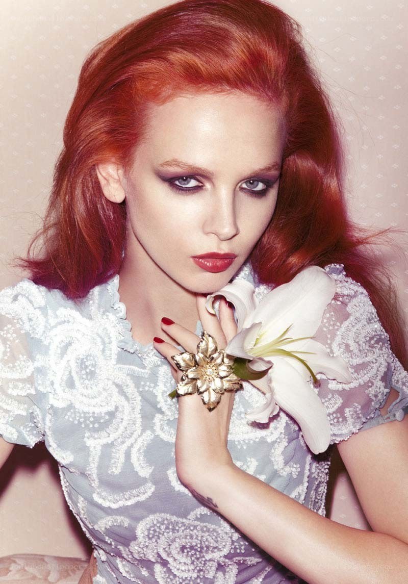 red-haired woman with flower