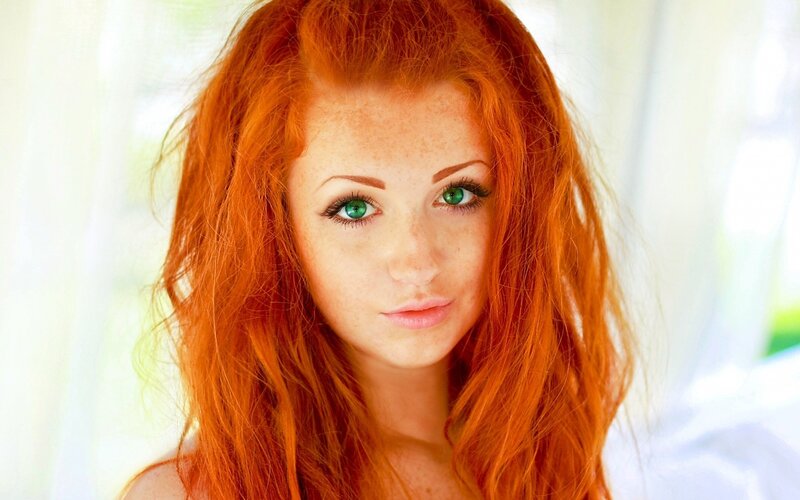 red-haired woman with green eyes