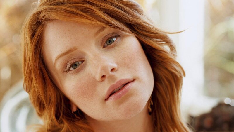 red-haired woman with green eyes