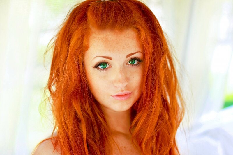 red-haired woman with green eyes
