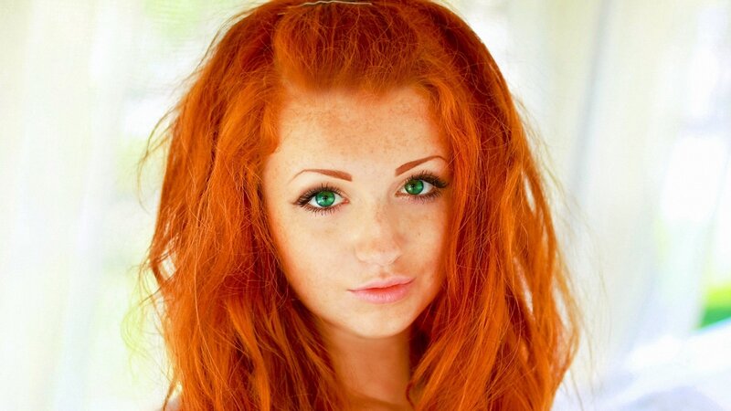 red-haired woman with green eyes