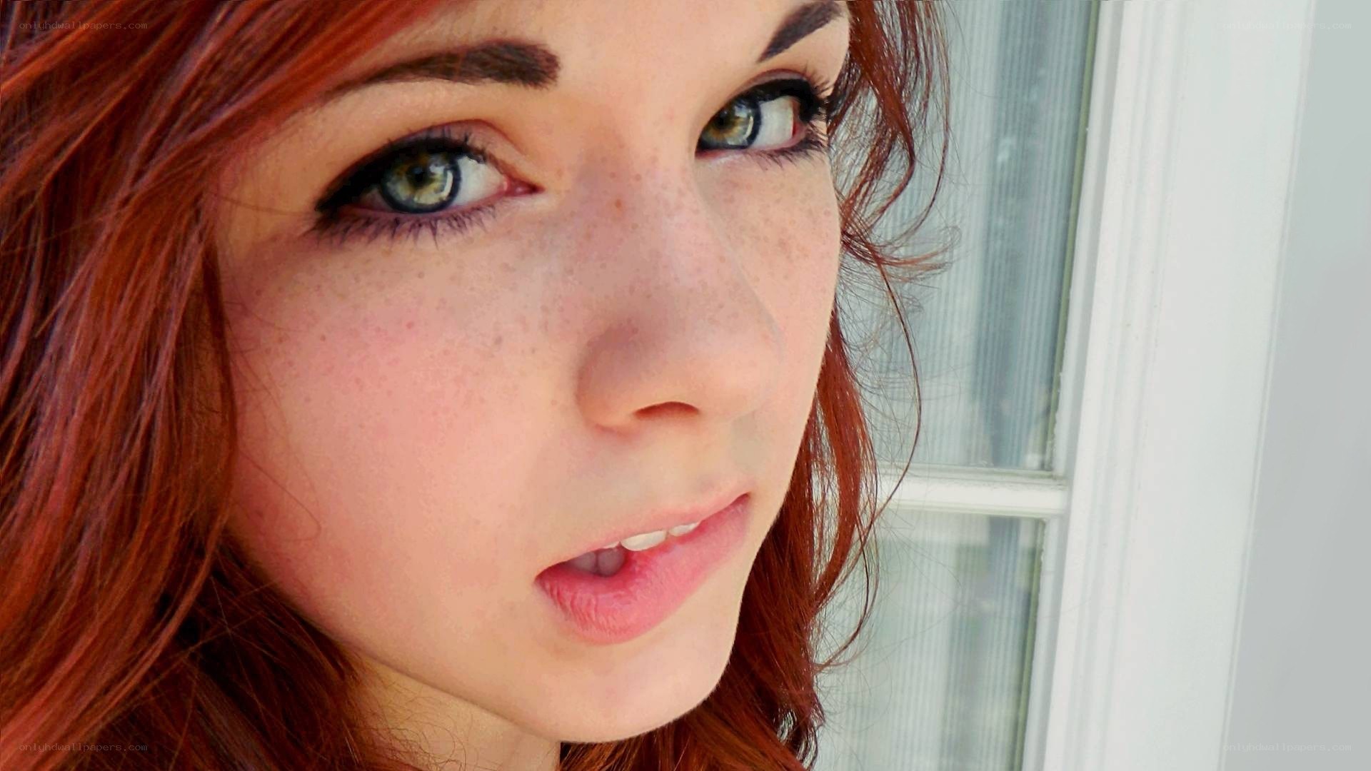 red-haired woman with green eyes
