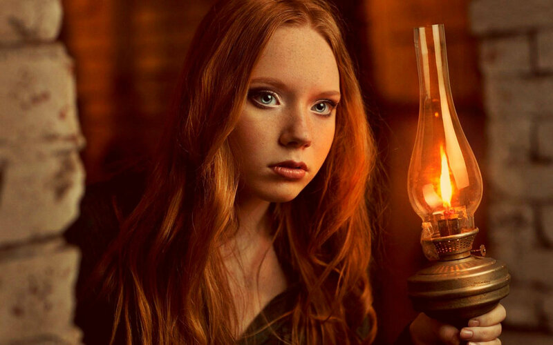 Red-haired Woman with Lamp