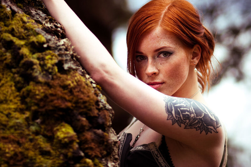 Red-haired woman with tattoo