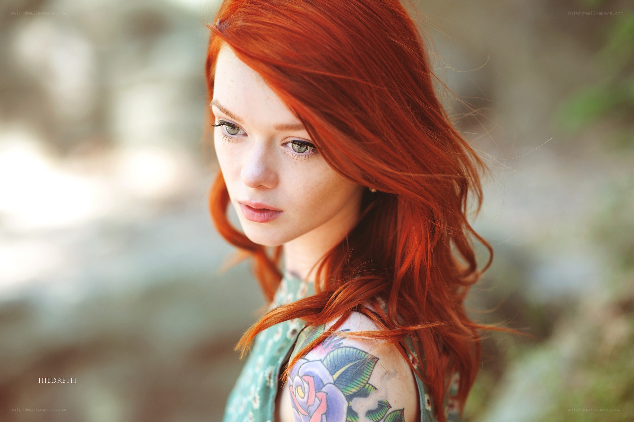 red-haired woman with tattoo