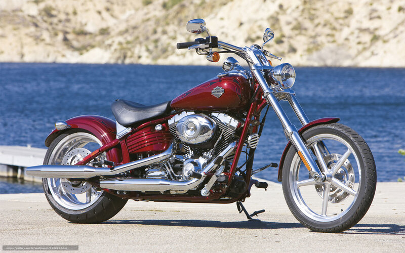 Red Harley-Davidson motorcycle by water