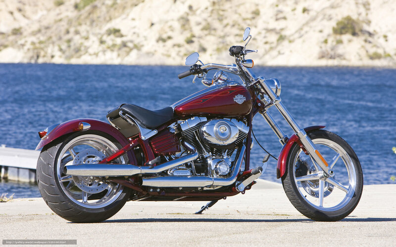 Red Harley-Davidson motorcycle by water