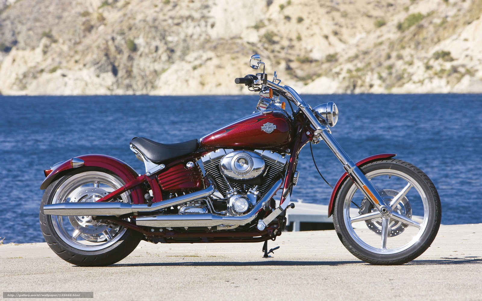 Red Harley-Davidson motorcycle by water