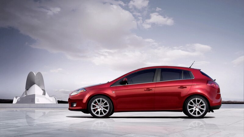 Red hatchback car on display