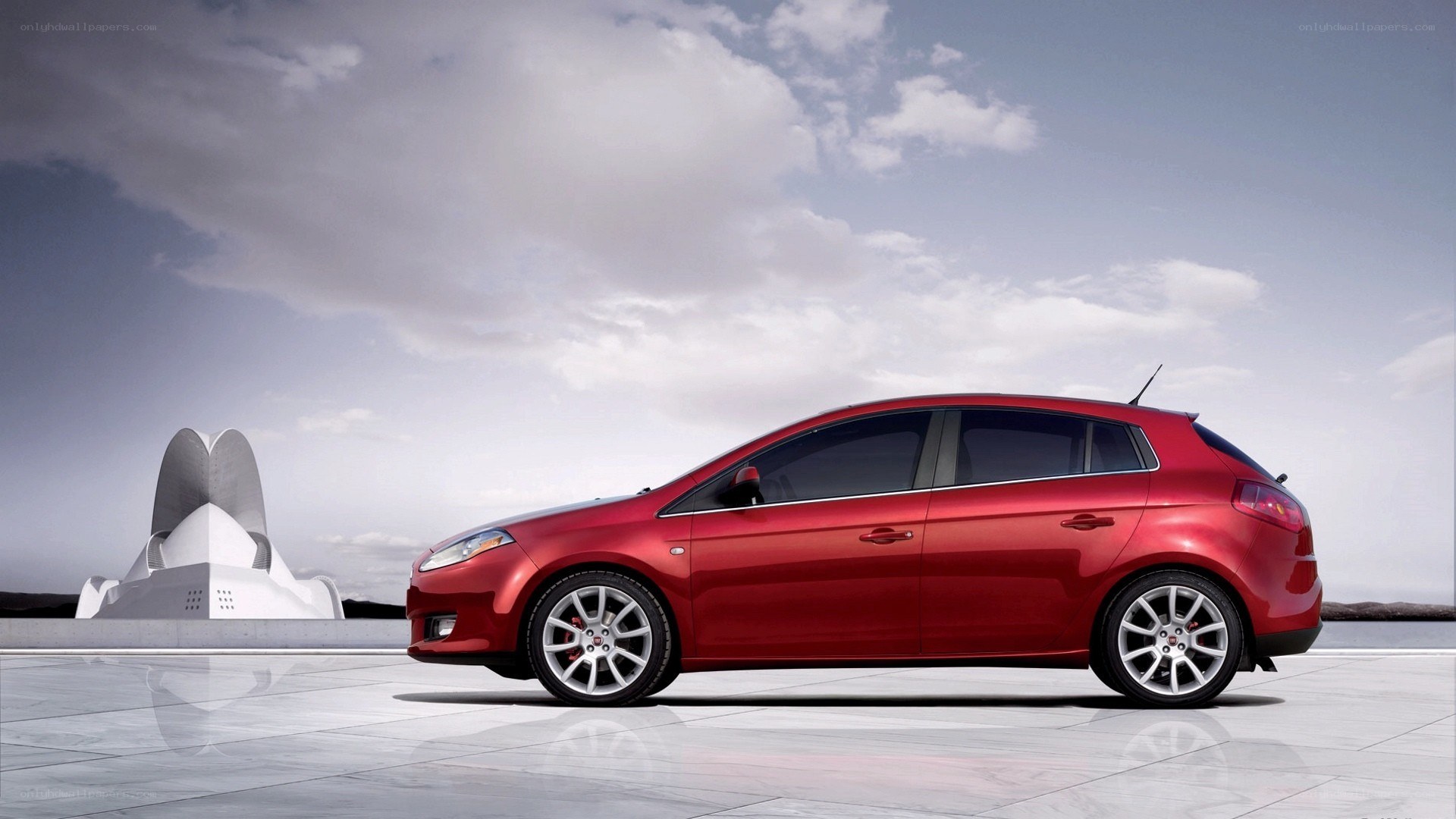 Red hatchback car on display