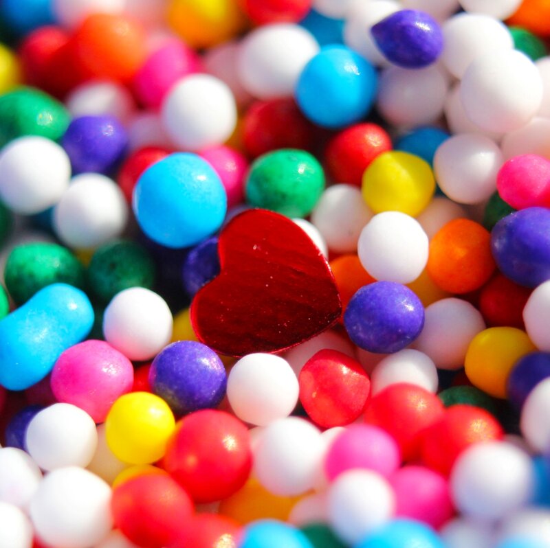 Red Heart Among Candies