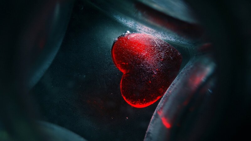 red heart in dark container