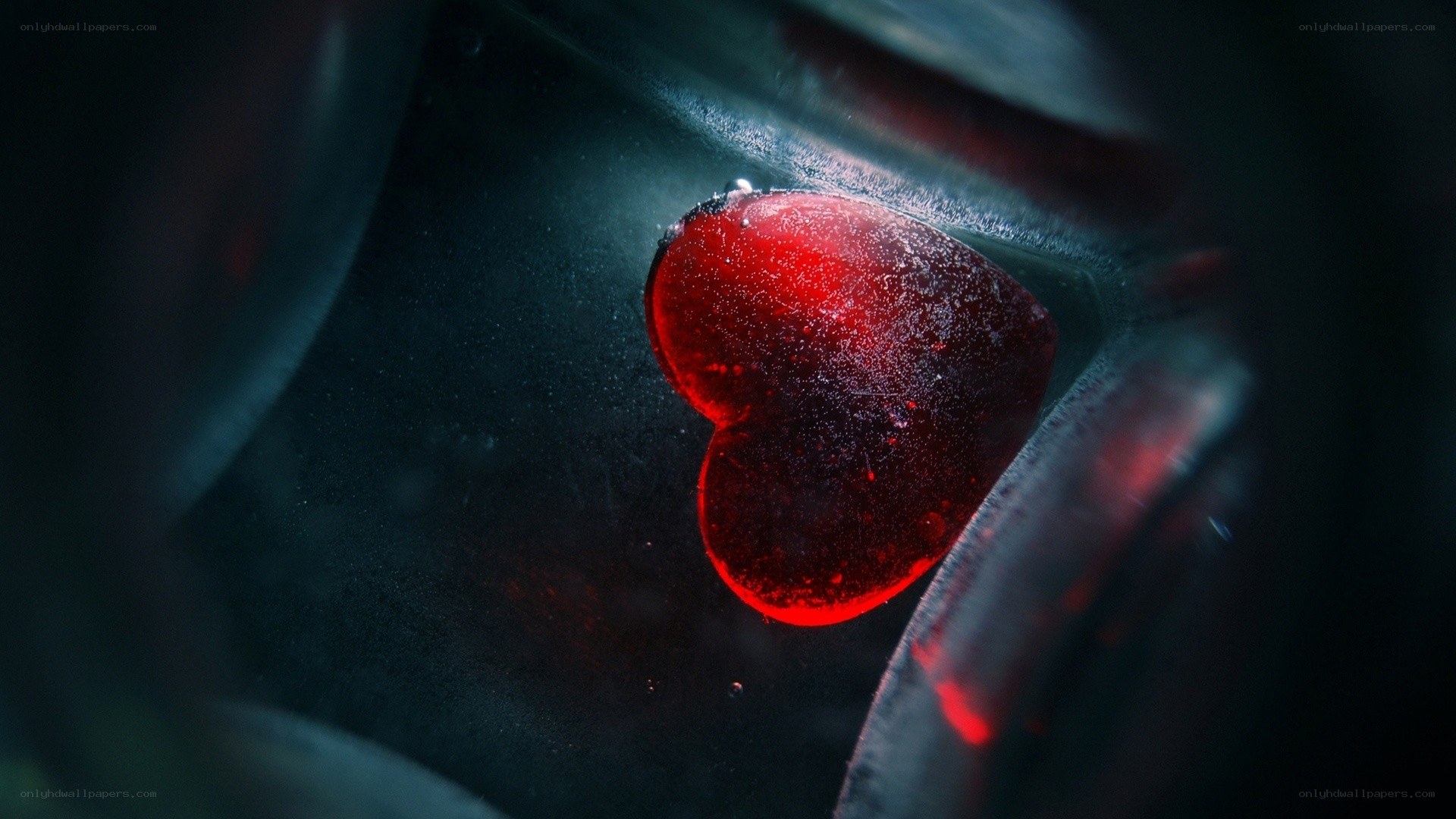 red heart in dark container