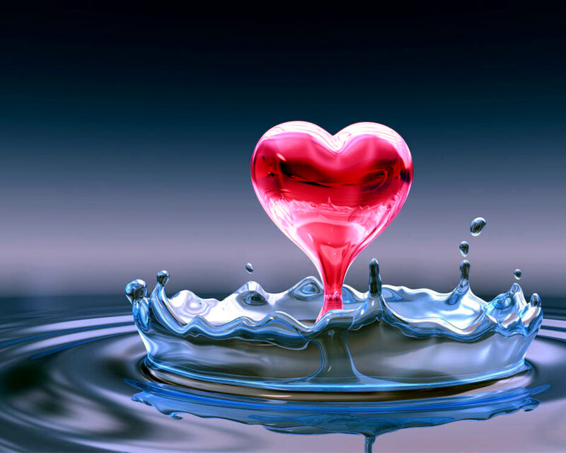 Red heart in water splash