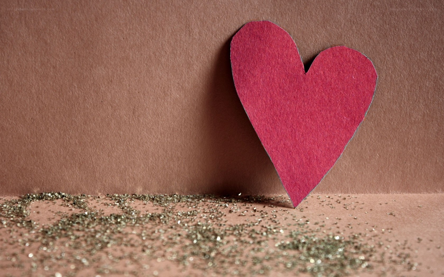 red heart on brown paper