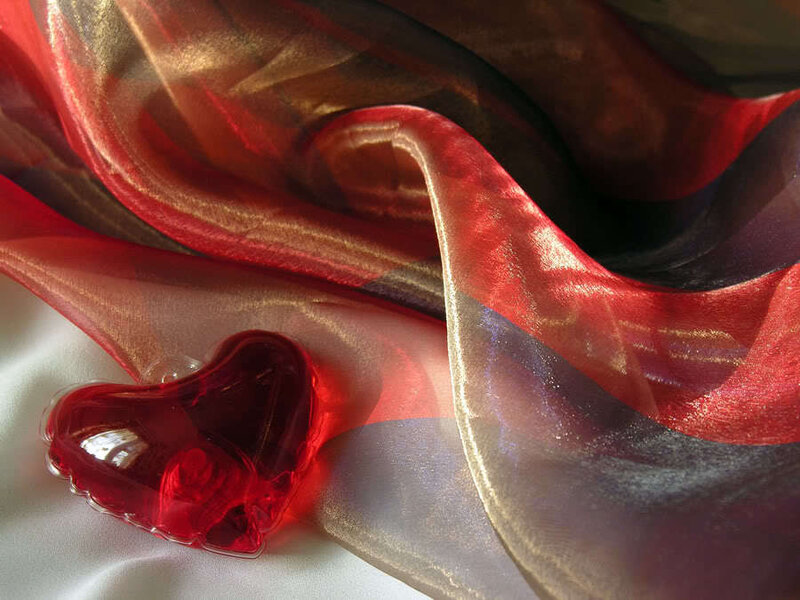 Red heart on fabric