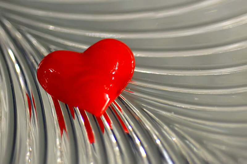 Red heart on glass surface
