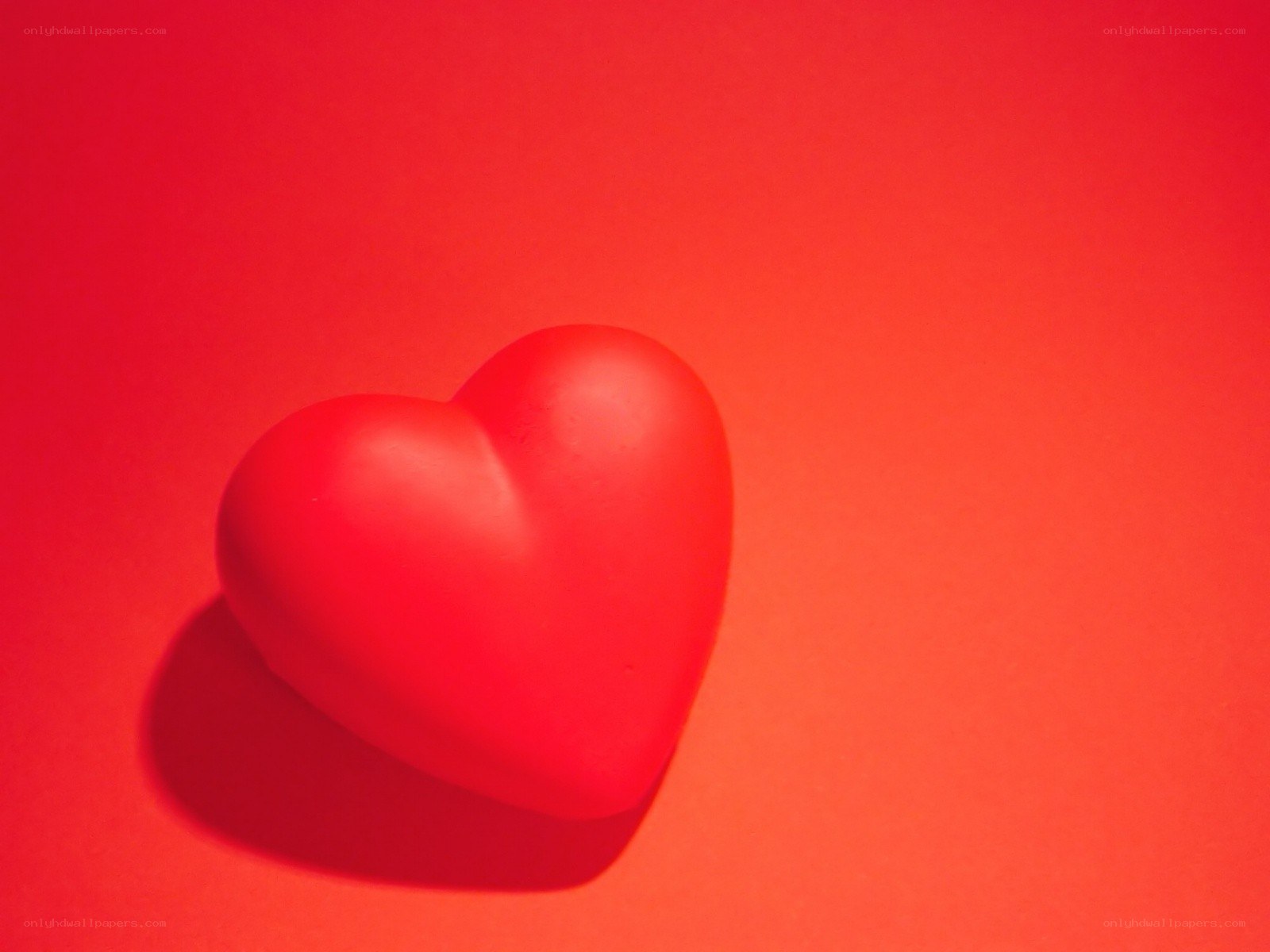 red heart on red background