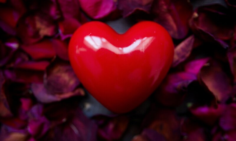 Red Heart on Rose Petals