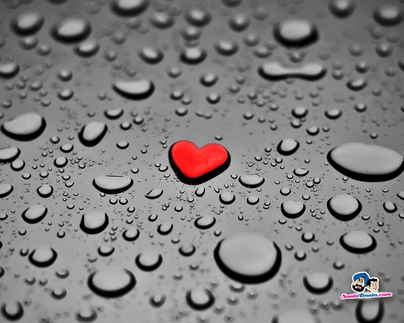 Red heart on wet surface