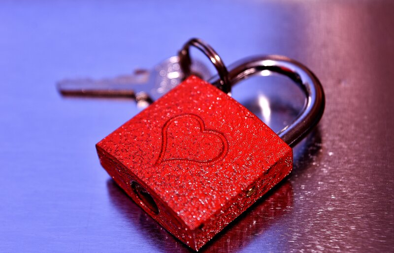 Red heart padlock with key
